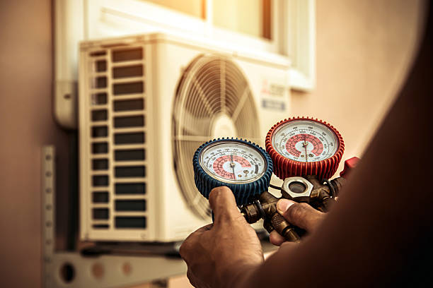 Professional Air Conditioning Service technician working in Guthrie, KY